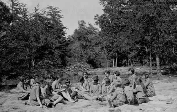 Girl Scouts meeting together outdoors in 1930